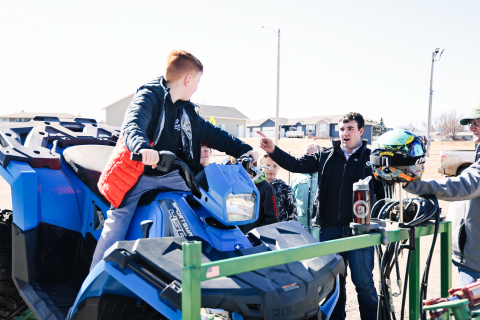 WSHS senior Ridge Roduner talks about ATV safety as elementary students take their turn on an ATV simulator. KRISTI HINE / TRUE DAKOTAN