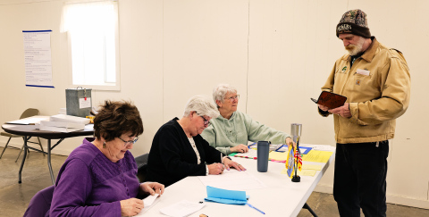 Wessington Springs poll workers (left to right) Kay Thompson, Pam Frank and Vicki Brodkorb help voter Jesse Rogers check in and receive his ballot on Tuesday, April 8, 2025. KRISTI HINE / TRUE DAKOTAN
