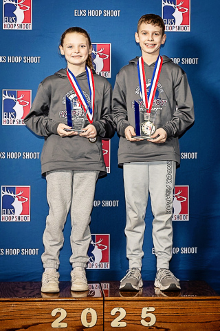 COURTESY PHOTO Caralina, left, and Chase Mebius of Hartford pose with trophies after winning their respective division of the regional Elks Hoop Shoot Contest last month. The duo are the grandchildren of Mike and Terri Mebius of Wessington Springs. The siblings will now participate in the National Finals on April 26.
