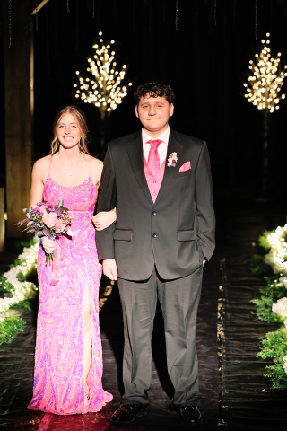 Senior Will Bruckner escorts Sydney Richardson.