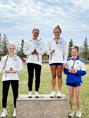 PHOTO COURTESY BECKY KRUEGER The 800m relay of Bailey Yost, Logan Mohling, Mariah Messmer, and Kenzie Kolousek combined efforts for 1:56.86 to cross the line in 1st place.