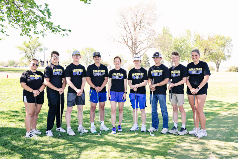 Varsity Spartan golfers, left to right: Taylor Braun, Brett Miller, Luke Larson, Blake Miller, Head Coach Regina Teveldal, JD Thompson, Heyns Bothma, Tucker Thompson, Kaitlyn Braun.