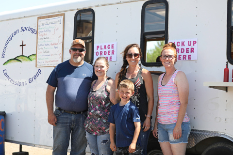 TRUE DAKOTAN FILE PHOTO Church concessions volunteers Bernard and Reina Ford, Christina and Maverick Roduner and Leslie Tanke took a quick break from serving up hungry rodeo fans and contestants during the July 2021 Foothills Rodeo.