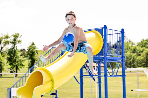 Lorin Schaller of Wessington Springs made an athletic leap off the diving board to catch a football thrown from the deck by Oakley Thompson of Tea. 