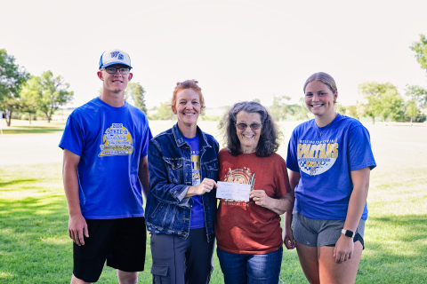 Shown during a check presentation held Monday, June 23, 2025 are, left to right: Spartans Golf varsity athlete Luke Larson, Head Coach Regina Teveldal, Pair of Jacks event organizer Jean Ferguson (Joyce Krueger not pictured), Spartans Golf varsity athlete Kaitlyn Braun. KRISTI HINE / TRUE DAKOTAN
