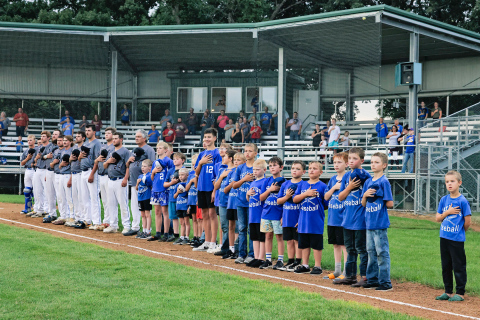 Little League Springs baseball players joined the Springs Owls on the big field for lineup and the national anthem during their end-of-season celebration. 