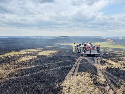 A fireman surveys the extent of the burn area. PHOTO COURTESY CHRIS SCHIMKE