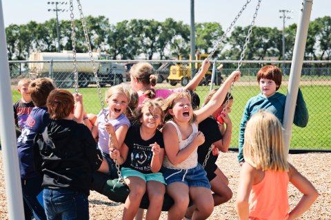 Wolsey-Wessington Elementary students make the most of recess on the school’s brand-new playground, the first phase of a $2 million facilities project supported by the community. Construction equipment in the background marks progress on the district’s new track and football field.