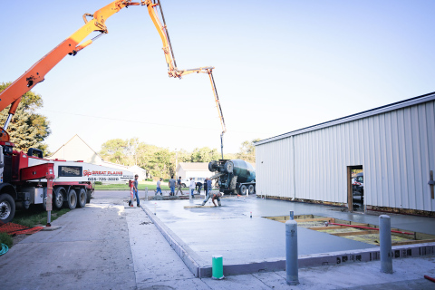 Crews from C. Eagle Construction and subcontractors pour the concrete floor of the new ag lab at Wessington Springs Middle/High School last week. 
