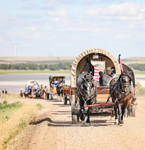 Jerry Fastnacht and Mark Reindl lead their team back to the Kyle Evans Memorial Wagon Train campsite near Crow Lake. While day one of the event started out damp and cold, the sun and mild weather returned for the second day, with participants eager to hitch their wagons and hit the trail. (KRISTI HINE / TRUE DAKOTAN)