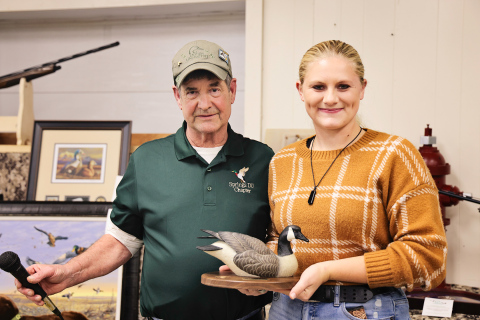 Kenzee Schafer was recognized for her decades-worth of paintings she has donated to the banquet, raising tens of thousands of dollars for the organization. She is shown with Tom Mebius. 
