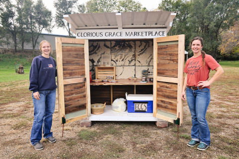 Sisters Ruthe Lindvall (left) and Cheri Lopez, both of Wessington Springs, opened their self-service bakery stand, Glorious Grace Marketplace, on October 17. KRISTI HINE / TRUE DAKOTAN