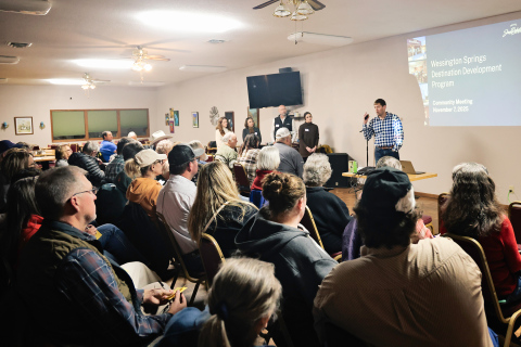 Troy Duxbury speaks to attendees during the Nov. 7, 2025 Destination Development community meeting at the Springs Inn in Wessington Springs. Standing beside him, from left, are Alix Collins and Seleni Matus of the International Institute of Tourism Studies at George Washington University, and Kirk Hulstein and Ciara Forest of Travel South Dakota. (KRISTI HINE / TRUE DAKOTAN)
