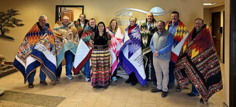 Farmers Union Board members are gifted Star Quilts by Team Buche Cares for their donation to the non-profit focused on feeding the hungry in rural and tribal communities. Left to right: David Reis, Chad Johnson, Jeff Kippley, Doug Sombke, Anna Halverson, Pass Creek Tribal Council Representative of the Oglala Sioux Tribe; Gail Temple, Karla Hofhenke, Larry Birgen, RF Buche, Team Buche Cares; Scott Kolousek and Oren Lesmeister. (COURTESY OF TEAM BUCHE CARES)