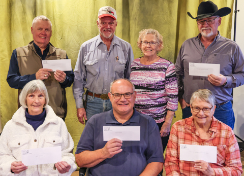 On Monday, November 17, 2025, Hub and Laura Kieser presented several checks to local organizations in memory of Hub’s mother, Gladys Kieser, who passed away one year ago. Representing the organizations are, front row, left to right: Delia Atkinson (Springs Area Bus), Rod Huisman (Blue Bag Nutrition Program), Eileen Woodruff (Jerauld County Museum). Back row: Brian Bergeleen (Opera House), Hub and Laura Kieser, Phil Wipf (Kyle Evans Western Heritage Center). (KRISTI HINE / TRUE DAKOTAN)