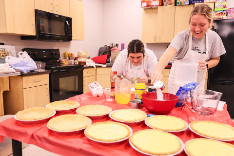 As area families sit down to enjoy their Thanksgiving meal together this Thursday, chances are they’ll be savoring a pie made by Wessington Springs High School (WSHS) students, as part of a long-standing local tradition. Pictured hard at work Tuesday during the annual service-oriented pie baking project are Tierney Knipfer and Kendall Kolousek, separating egg whites and measuring out sugar. 