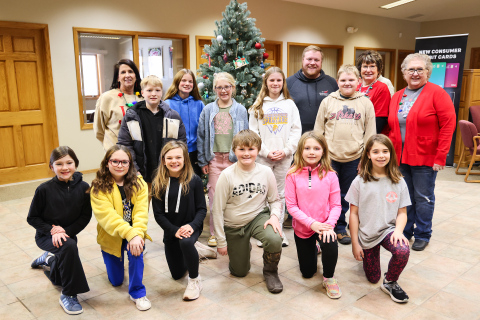 Front row, left to right: Blair Murphy, Raven Richardson, Carlayna Waters, Kolt Messmer, Hannah Wenzel and Paislei Bell. Back row, left to right: Fourth grade teacher Jen Roduner, Cooper Holt, Emme Havlik, Hayden Bultsma, Alice Heumiller, and Will Arhart. Bank employees Blake Willman, Susan Tebay and Connie Larson. 
