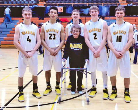 A moment of kindness shown nearly a decade ago has come full circle through a meaningful gift from the Gildemaster family, honoring the bond formed between Carol Gildemaster and the Wolsey-Wessington Warbirds basketball team during the 2016–2017 season. Shown left to right with Carol Gildemaster at center are Warbird seniors from the 2016-2017 basketball team Austin Kemnitz, Darian Ogunjemilusi, Riley Gohn, Bennett White, Darin Tschetter. Tanner Zemlicka was also a senior that year, he is not pictured. 