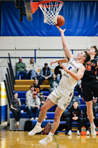 Colby Flowers goes up for a driving layup during Wessington Springs’ 64-58 win over Howard on Saturday, Dec. 20. Flowers led the Spartans with 20 points, shooting 9-of-14 from the field while adding two assists and two blocks