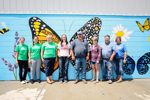 ACOTA board members and local artist Ruthe Lindvall gather during the unveiling of a community mural, one of several projects supported through partnerships focused on making art visible and accessible in Wessington Springs. 
