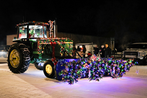 A tractor decked out in holiday lights rolls down Main Street as part of the Wessington Parade of Lights.