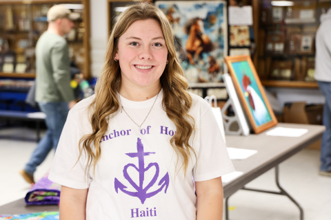 Wessington Springs High School senior Ella Fagerhaug stands in the elementary school lunchroom where she hosted a community fundraiser as her senior project, raising money to support children and families through Anchor of Hope Haiti.