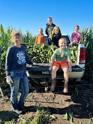 Students join local producer Suzanne Hamilton in harvesting corn, part of the hands-on learning behind Wolsey-Wessington’s growing farm-to-table program. CLOCKWISE FROM LEFT: Suzanne Hamilton, Oliver Urban, Simon Schnetzer, Eva Urban, Kenzy Schnetzer, Logan Schnetzer. (COURTESY PHOTO)
