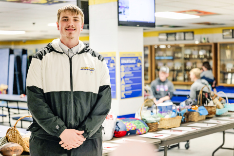 Grady Gran is pictured in the Wessington Springs Elementary School lunchroom, where he hosted a free-will donation meal and silent auction to benefit the WWSSC football team as part of his Senior Experience project. (KRISTI HINE / TRUE DAKOTAN)