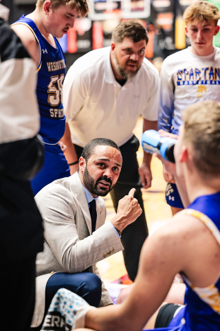Spartans gather around head coach Joey Mitchell as he delivers instructions during a timeout in the Region 2B semifinal against Castlewood. View over 100 photos from the game at www.truedakotan.com. (KRISTI HINE / TRUE DAKOTAN)