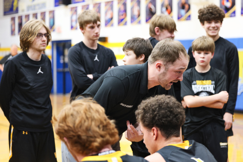 Wolsey-Wessington head coach Austin Kemnitz encourages his players from the sideline during the Warbirds’ Region 2B quarterfinal matchup against Wessington Springs on Tuesday, March 3.  View more photos from the game at www.truedakotan.com, click on Photo Galleries. (KRISTI HINE / TRUE DAKOTAN) 