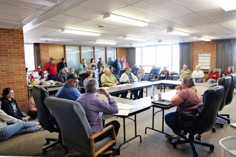 Residents packed Wessington Springs City Hall on Monday, March 9, 2026, many standing or seated on the floor, as the city’s zoning board held a public hearing on a request to rezone land for a proposed cryptocurrency mining facility. After hearing comments and questions from the public, the board voted 3-2 to recommend denying the rezoning request. (KRISTI HINE / TRUE DAKOTAN)