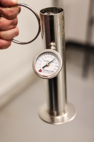 Using a Murphy cup and hydrometer, students worked toward the ideal 66.9% sugar concentration required for finished syrup. 