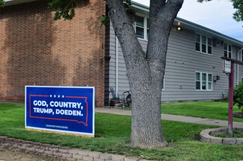 A Toby Doeden campaign sign outside 9 East 10th St in Groton, S.D. on June 15, 2026. The building is an apartment complex that Doeden’s 5-Star Management company operates. (Photo: Molly Wetsch/South Dakota News Watch)