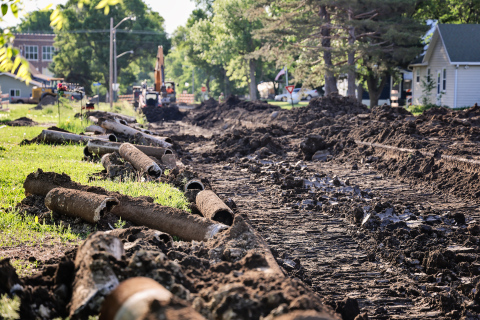 Old cast iron water mains removed from beneath 2nd Street sit alongside an active construction zone as crews continue work on Wessington Springs' water main replacement project. (KRISTI HINE / TRUE DAKOTAN)