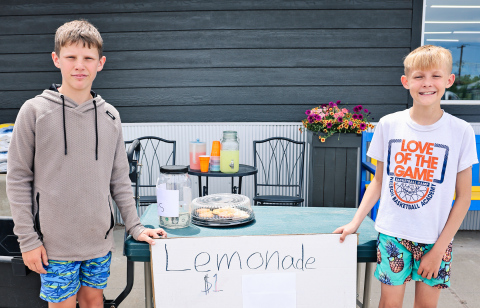 Ethan Heumiller and Holden Schelske, with a little help from Bosten Jensen (not pictured), served up one of Wessington Springs’ first lemonade stands of the summer outside Springs Food Market last week. 