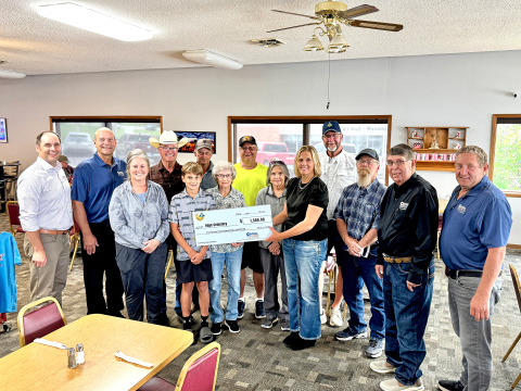 Hope Cemetery accepts a $1,500 grant for fence improvements. Pictured from left to right: Central Electric General Manager Designate Ryan Mueller, General Manager Ken Schlimgen, Melissa Schimke, Dale Schimke, Parker Couch, Larry Powell, Norma Powell, Herman Eilers, Susan Olson, Operation Round-Up Trustee Amber Kolousek, Rick Couch, Ron Thompson, Central Electric Director Mark Reindl and Central Electric Director Merl Bechen. 