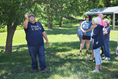 Wessington Springs High School Vo-Ag instructor Brady Duxbury points out identifying characteristics of trees during “A Walk in the Park” on May 31 in Wessington Springs City Park.