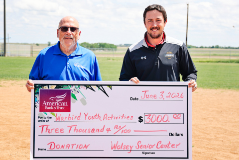 Wolsey Senior Center board member Dave Burnison, left, presents a $3,000 donation to Riley Donovan to support the Wolsey Summer Recreation baseball program. The contribution helped expand the program to include both tee ball for ages 4-5 and coach-pitch baseball for ages 6-7. Nearly 40 youth are participating this summer, with games scheduled Mondays and Wednesdays throughout June. (KRISTI HINE / TRUE DAKOTAN)