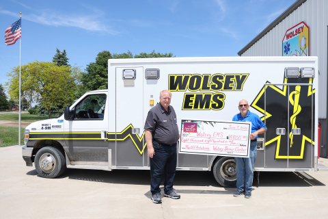Wolsey Senior Citizen Center Incorporated board member Dave Burnison, right, presents an $8,800 check to Wolsey EMS Director Scott Spiehs at the Wolsey Fire Hall. The donation retired the remaining balance on the community’s ambulance, helping pay off approximately $170,000 in debt in just two years through community fundraising efforts, donations and grants. (KRISTI HINE/TRUE DAKOTAN)