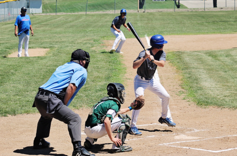 Dylan Schimke bats with Brock Krueger at third base during Sunday’s doubleheader against Chamberlain. Schimke drove in five runs across the two games as the Owls swept the Mallards. (PHOTOS BY CRAIG WENZEL FOR THE TRUE DAKOTAN)