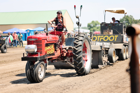 Despite triple-digit temperatures, the Alpena community turned out Saturday to support the Alpena Volunteer Fire Department’s annual tractor pull and enjoy a full day of activities. A tractor powers down the track during the day’s competition.