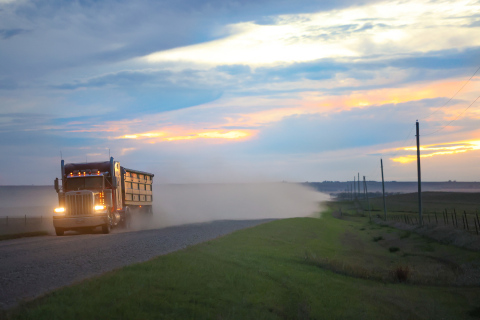 A semi hauling grain travels east along 221st Street, a major route for harvest traffic through Jerauld County. (TRUE DAKOTAN FILE PHOTO) LEFT: Newly installed signs mark the new 40 mph speed limit along 221st Street. (PHOTO COURTESY JERAULD COUNTY SHERIFF’S OFFICE)