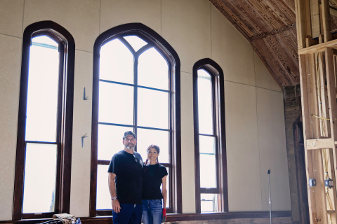 Jim and Carolyn Ferguson stand inside the former United Church of Christ in Wessington Springs, where they have spent the past several years transforming the historic church into their home. The large west-facing windows behind them will eventually be replaced with double doors, creating the home’s new main entrance and opening onto a covered deck.