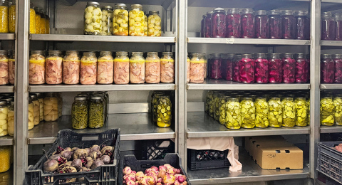Pickled and preserved vegetables in a storage room at Spring Valley Colony, pictured July 17, 2026. (PHOTO: ELENA TITTEL/SD NEWS WATCH)