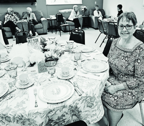 Susan Arnott seated at the table she decorated at the 2022 Festival of Tables. TRUE DAKOTAN FILE PHOTO