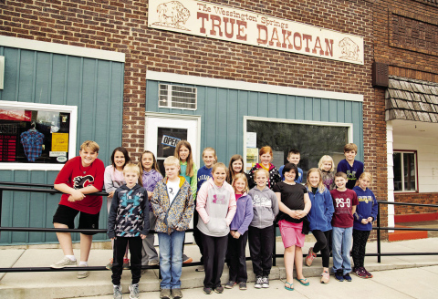 Members of the Wessington Springs Elementary School “WSES News” staff pose outside the True Dakotan office during a 2019 field trip to learn about local news. Several students pictured are now members of the graduating Class of 2026, a reminder of how quickly the years, and stories, have unfolded. (TRUE DAKOTAN FILE PHOTO)