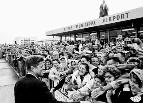 PHOTO COURTESY OF THE JOHN F. KENNEDY PRESIDENTIAL LIBRARY AND MUSEUM, BOSTON President John F. Kennedy, visiting South Dakota to dedicate the recently completed Oahe Dam, greets crowds at the Pierre Municipal Airport on Aug. 17, 1962.