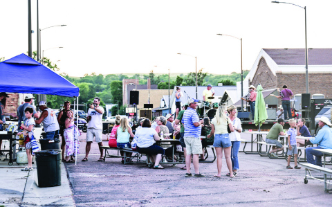 Community members gather on Main Street in Wessington Springs for the Sons of the American Legion Community Supper following Saturday’s annual Poker Run. The event, held in memory of Michial Brodkorb, raises funds to support local organizations, clubs and community projects. (KRISTI HINE / TRUE DAKOTAN)