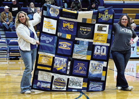 WSHS senior Taylor Braun (right) is pictured with her senior project mentor, Hilary Grohs, during the quilt auction portion of her “Live Like Lisa” fundraiser. PHOTO COURTESY JILL BRAUN