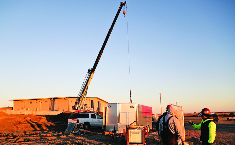 Although underground and ground-level progress has been underway for months, the arrival of a crane to the construction sight drew onlookers Tuesday morning during elementary school drop off. With grade beams completed and backfilled, precast hollow plank will be set via crane in preparation for concrete. Additional school news can be found in this week’s print and e-edition within the Wessington Springs School District Board of Education meeting minutes published on PAGE EIGHT KRISTI HINE / TRUE DAKOTAN
